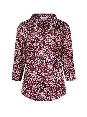 a woman wearing a red and white shirt
