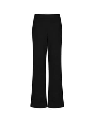 a woman wearing black pants and a white shirt
