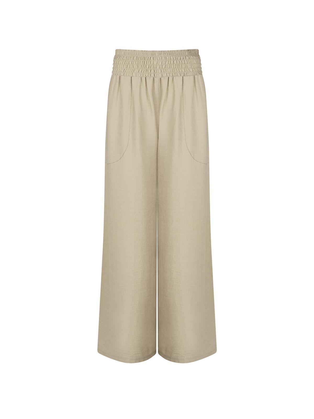 a picture of a woman wearing a beige pants