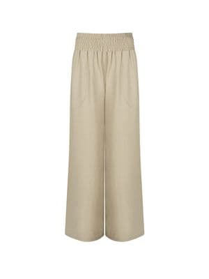 a picture of a woman wearing a beige pants