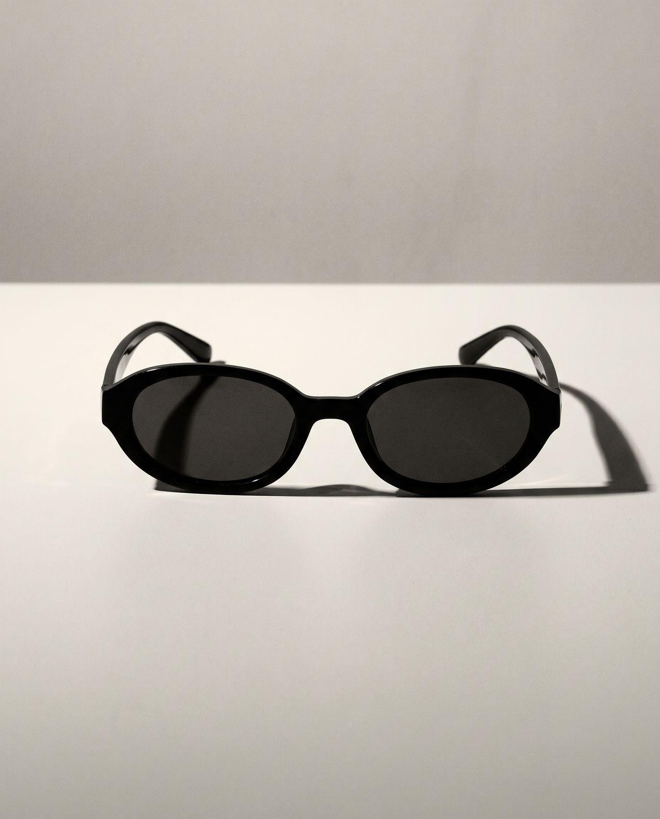 a pair of sunglasses sitting on top of a table