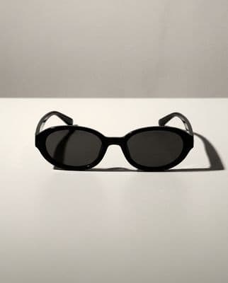 a pair of sunglasses sitting on top of a table