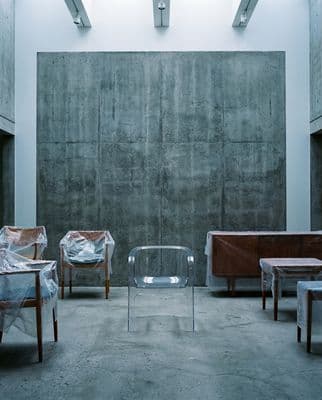 a group of chairs and tables in a room