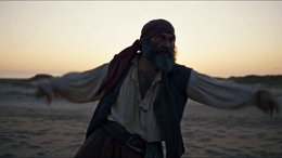 a man with a beard and a beard wearing a pirate costume