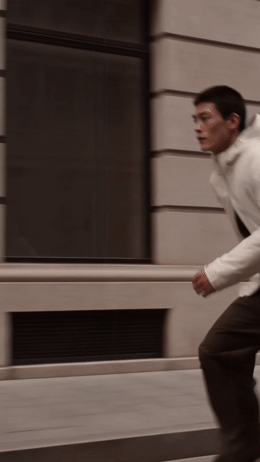 a man riding a skateboard down a street