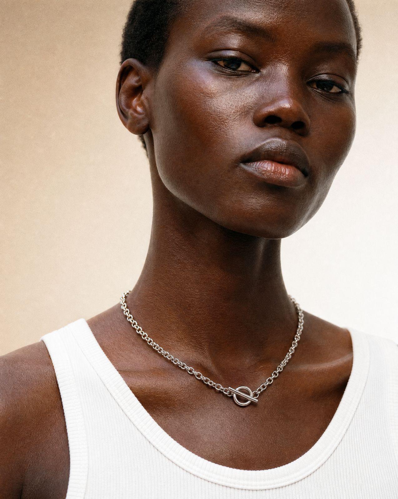 a woman with a necklace on her neck