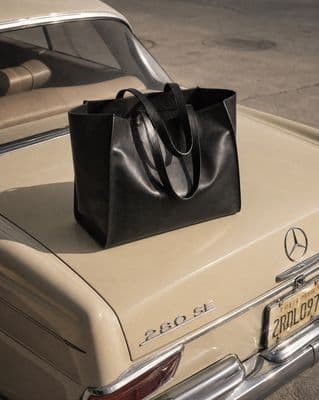 a black bag sitting on top of a car