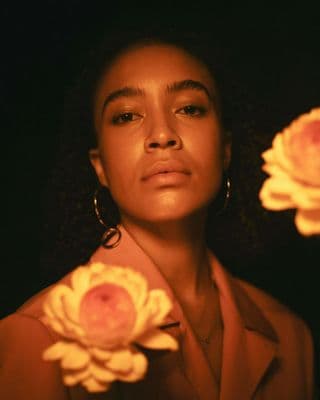 a woman with a flower in her hand