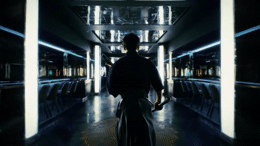 a man walking down a hallway in a building
