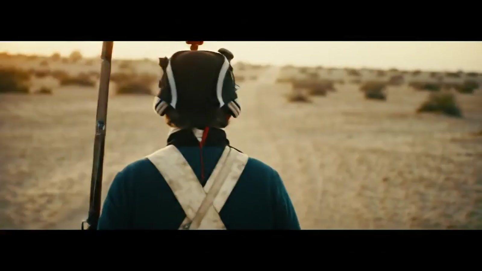 a person with a back pack on a dirt road