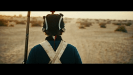 a person with a back pack on a dirt road