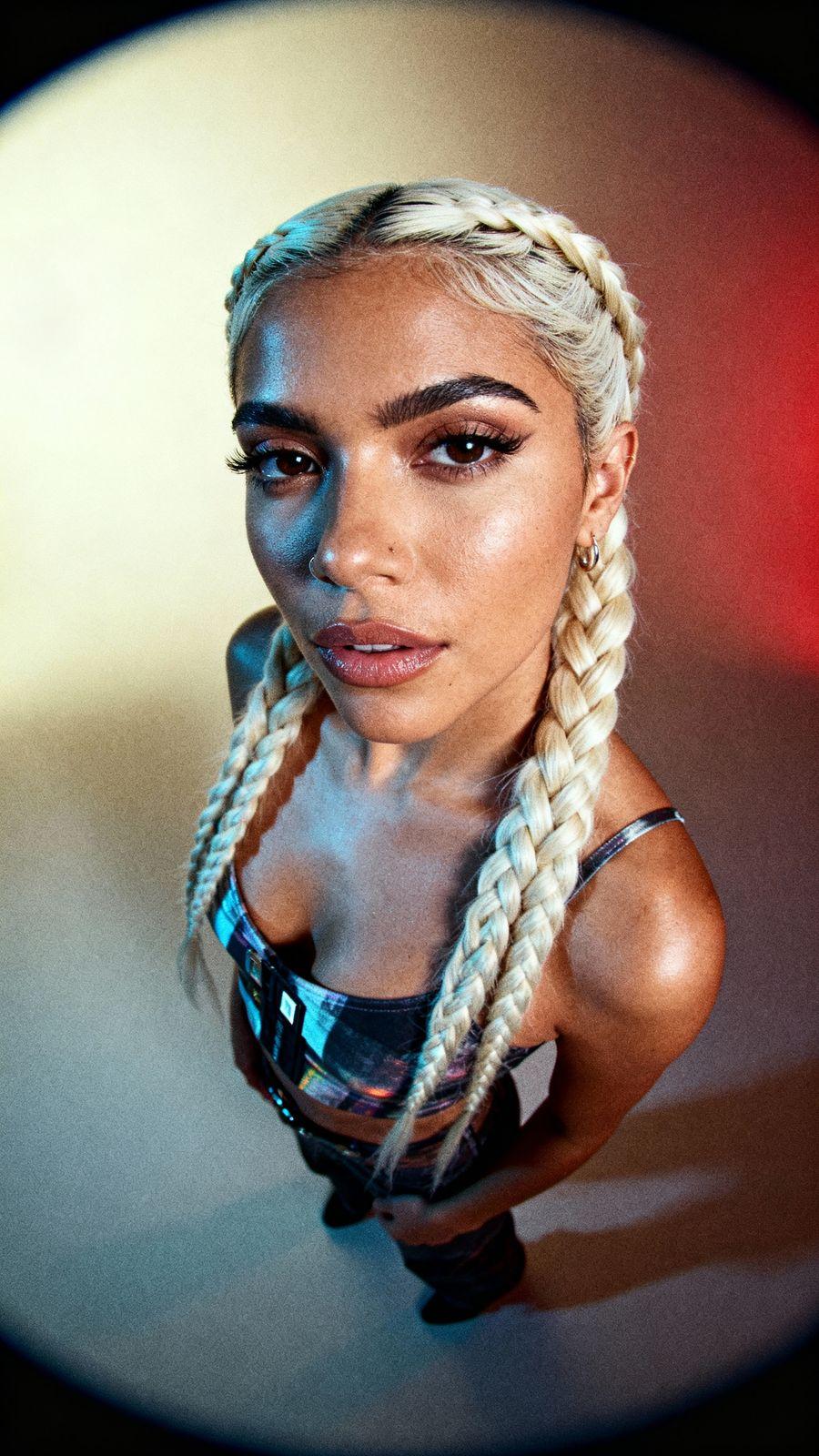 a woman with long blonde hair and braids