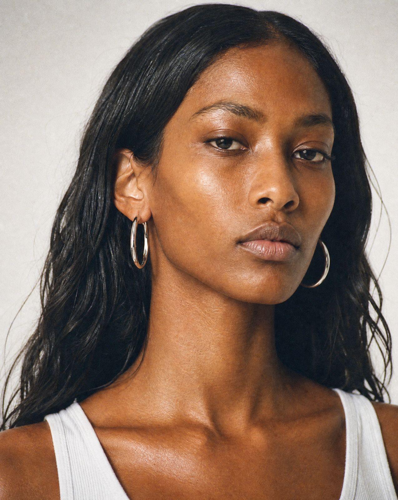 a close up of a person wearing a tank top
