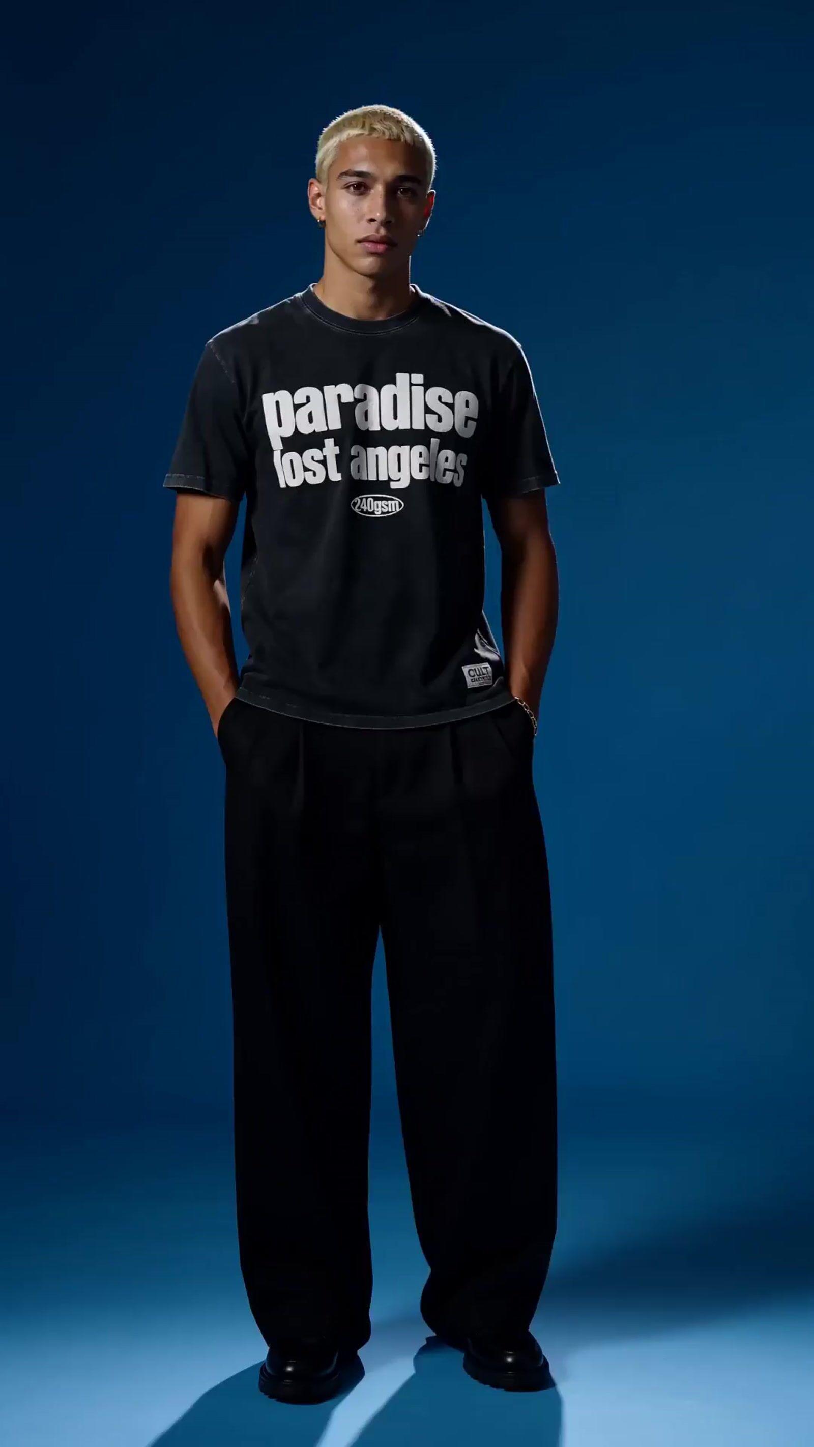 a man in a black shirt and black pants