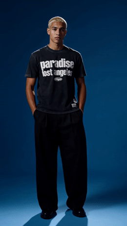 a man in a black shirt and black pants