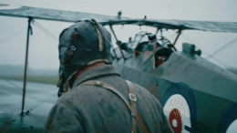 a man standing in front of an airplane
