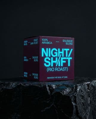 a purple box sitting on top of a rock