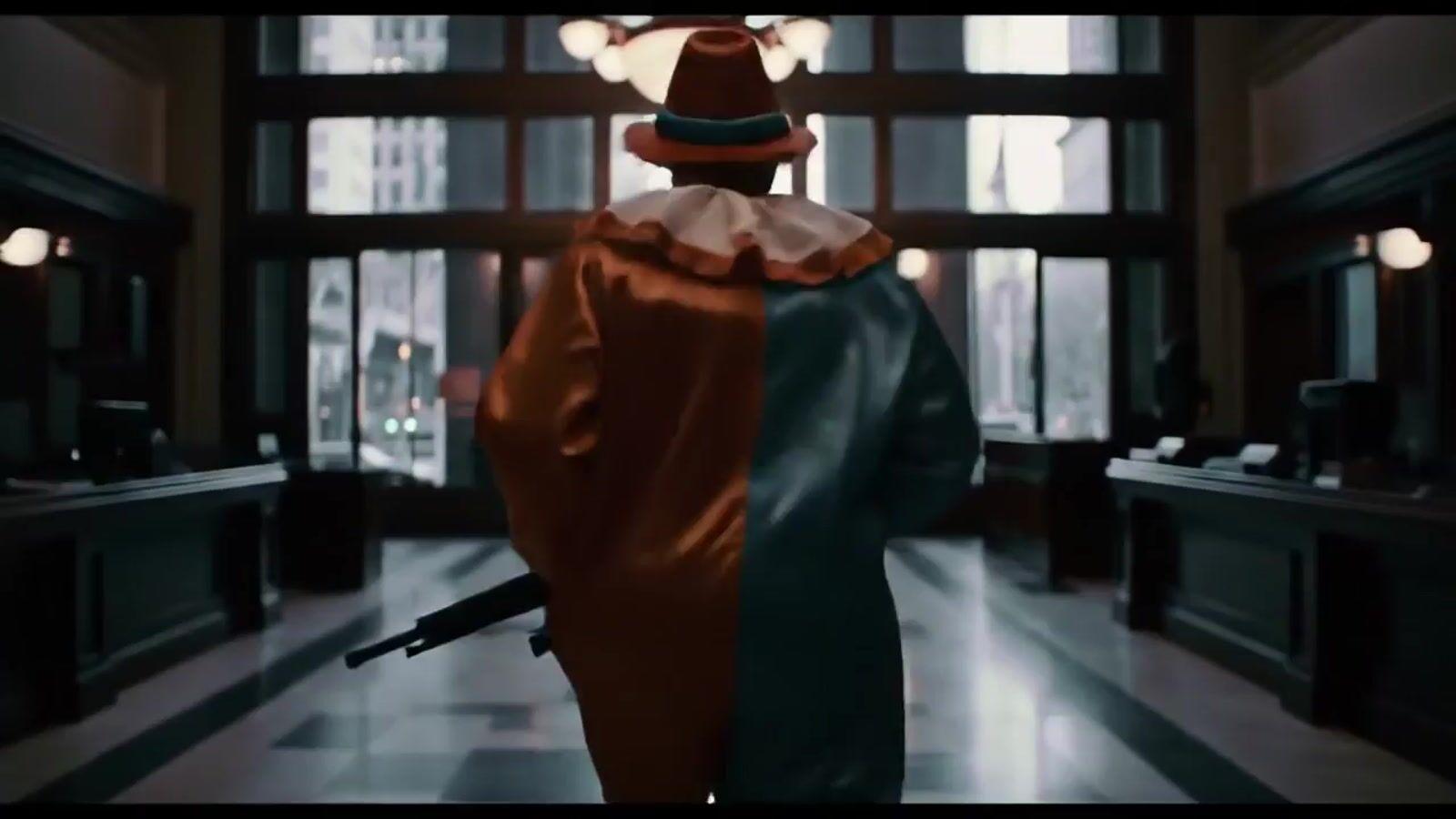 a person with a hat and a gun in a room