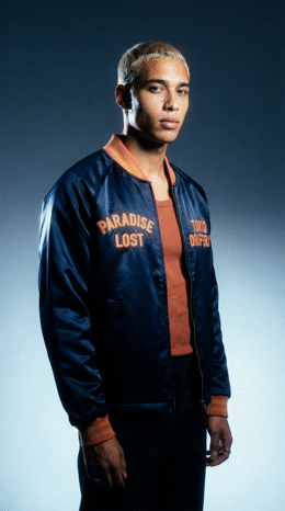 a man in a blue jacket is posing for a picture