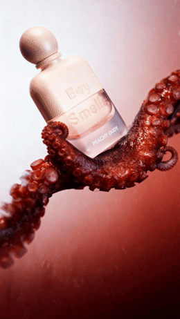 an octopus is holding a bottle of perfume