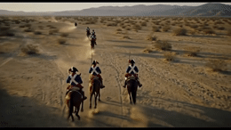 a group of people riding on the backs of horses