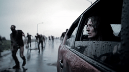a group of people walking on a wet road