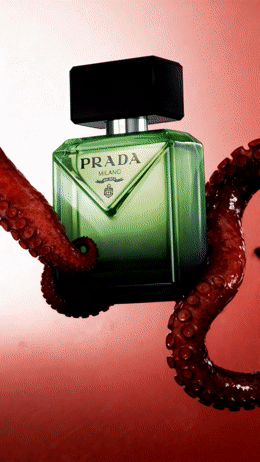 a bottle of prada next to an octopus