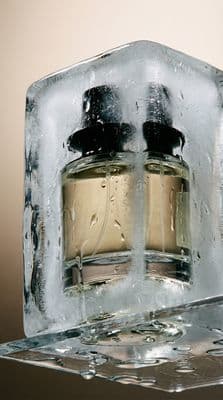 a couple of bottles of perfume sitting on top of a table