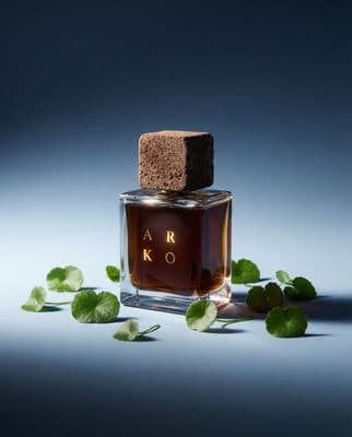 a bottle of perfume sitting on top of a table