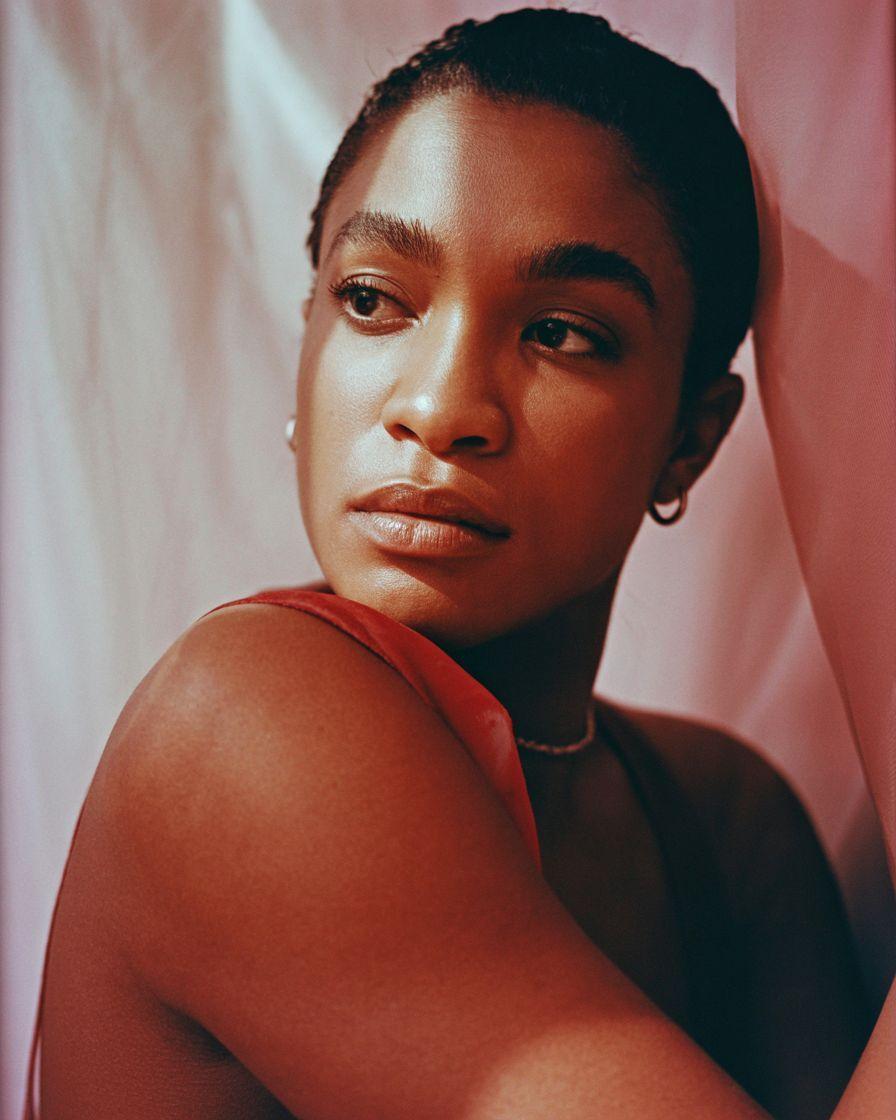 a close up of a person wearing a necklace