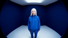 a woman with white hair standing in a room