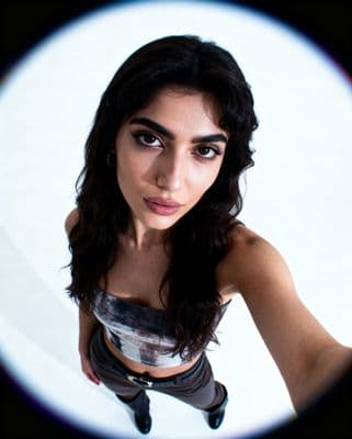 a woman with a camera around her neck