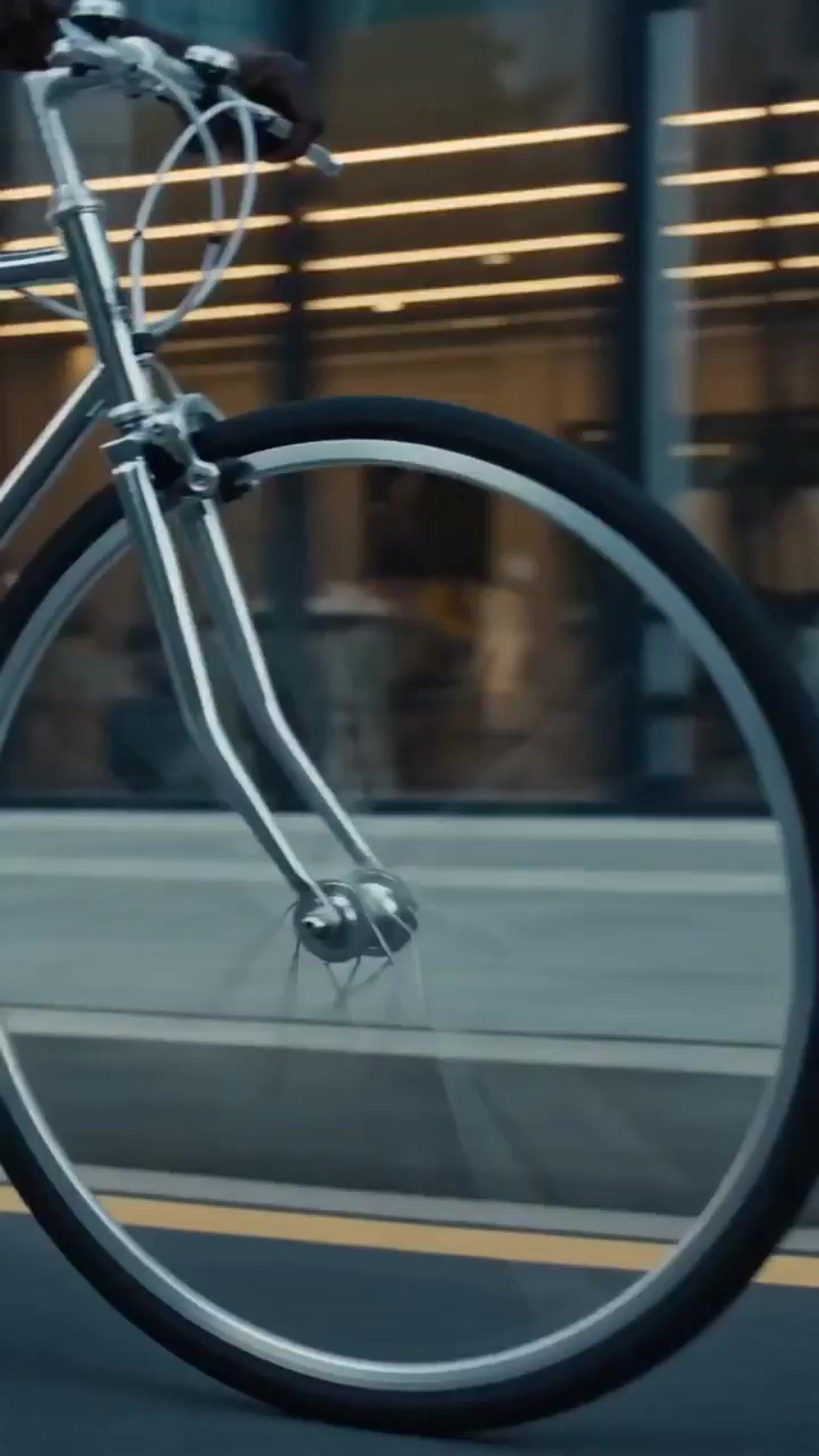 a close up of a bike on a city street