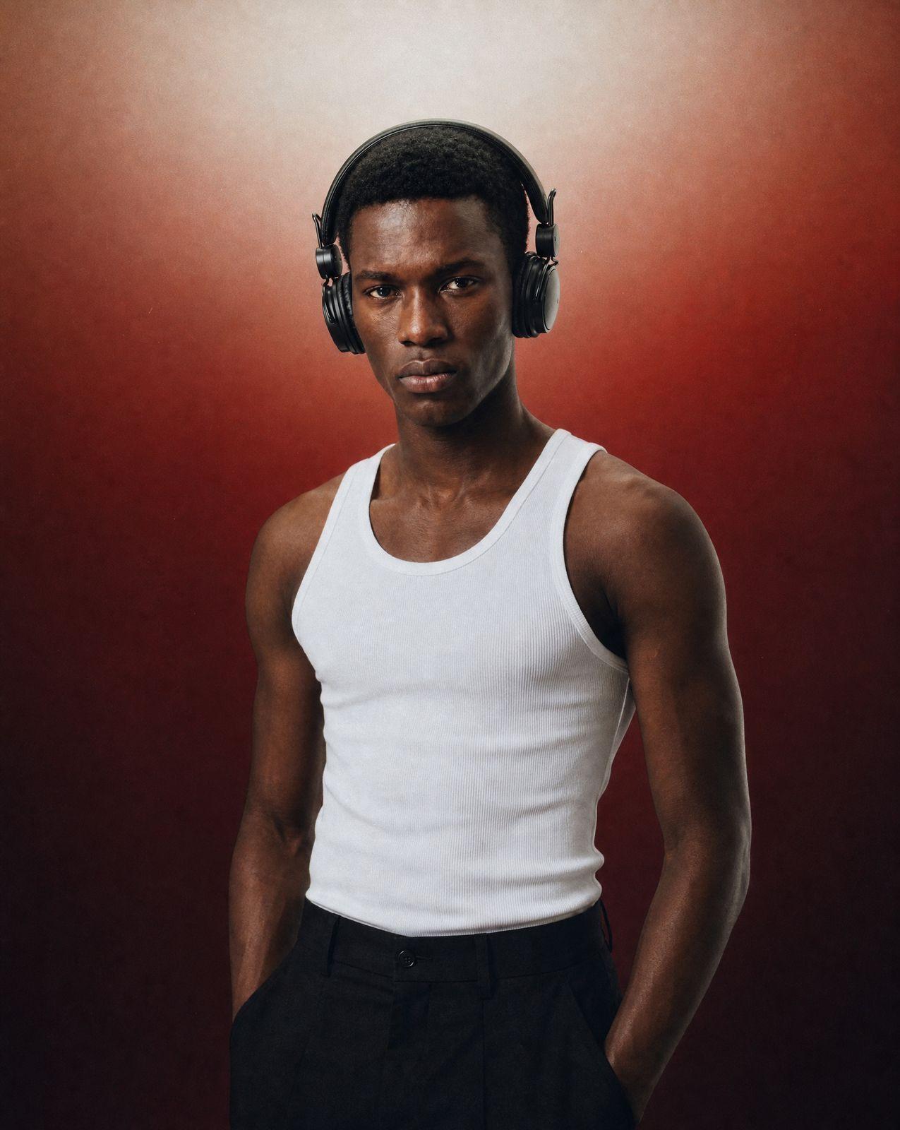 a man wearing headphones and a tank top