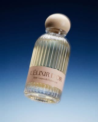 a bottle of perfume sitting on top of a table