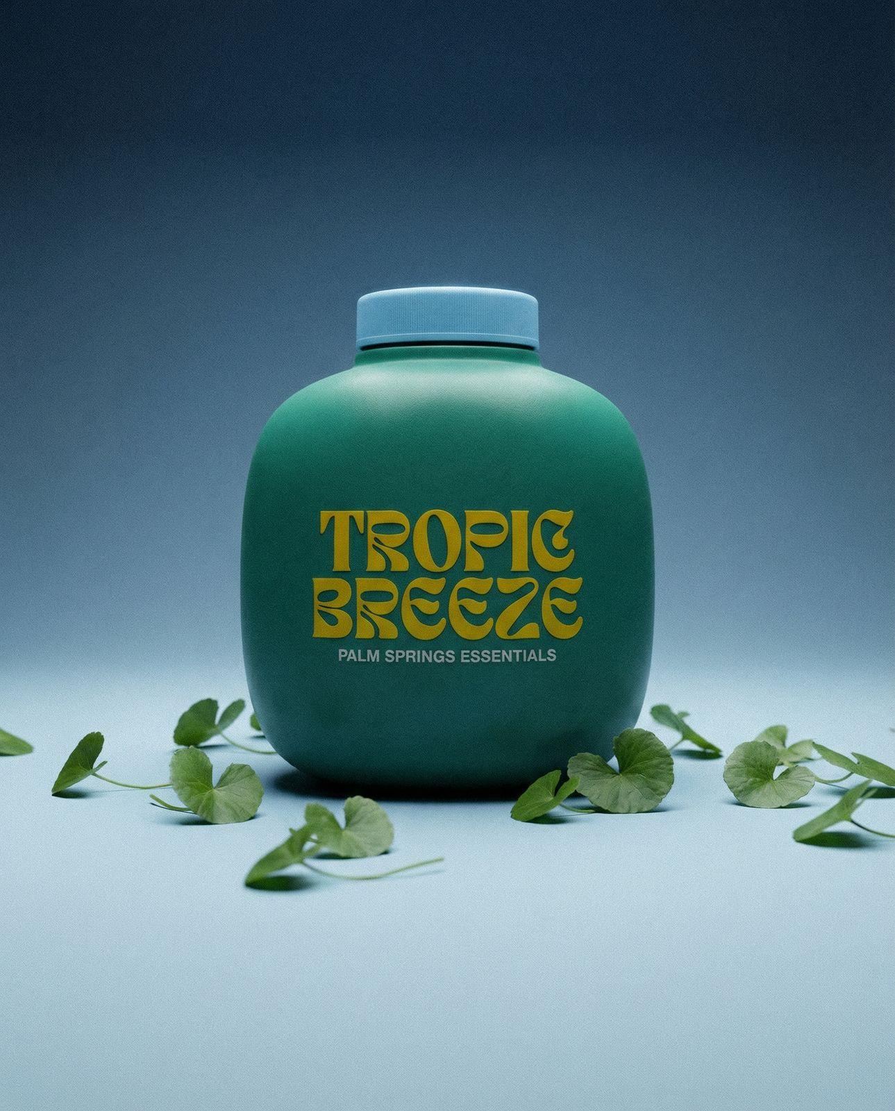 a bottle of tropic breeze water sitting on a table