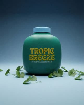 a bottle of tropic breeze water sitting on a table