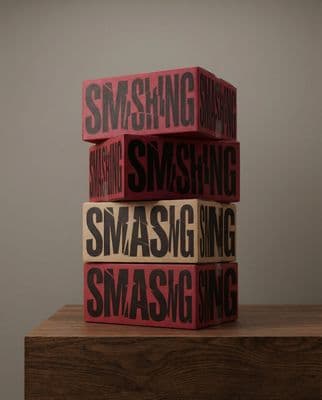 a stack of three wooden blocks with the words samsung printed on them
