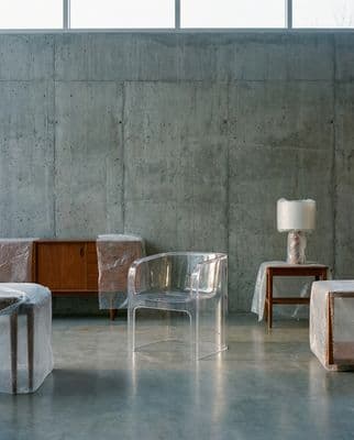 a couple of chairs and a table in a room