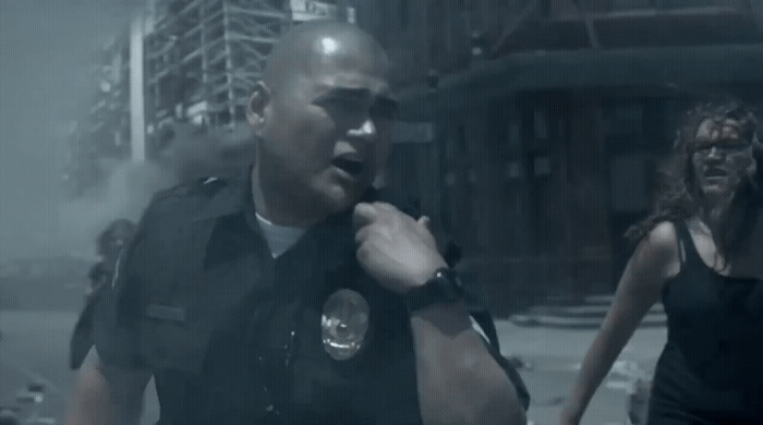 a police officer standing next to a woman