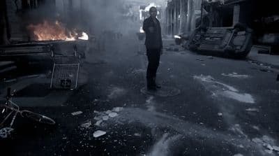 a man standing in the middle of a street