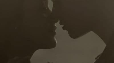 a couple of people that are kissing each other