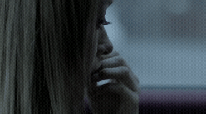 a blonde woman talking on a cell phone