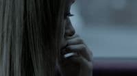 a blonde woman talking on a cell phone