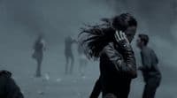 a woman talking on a cell phone in a foggy area