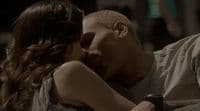 a man kissing a woman on the cheek
