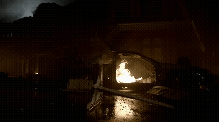 a fire burning inside of a small oven