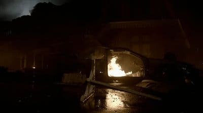 a fire burning inside of a small oven