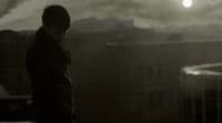 a man standing in front of a city skyline