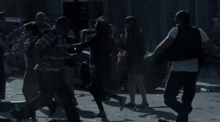 a group of people walking down a street